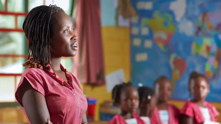 A teacher leading a lesson while pupils listen